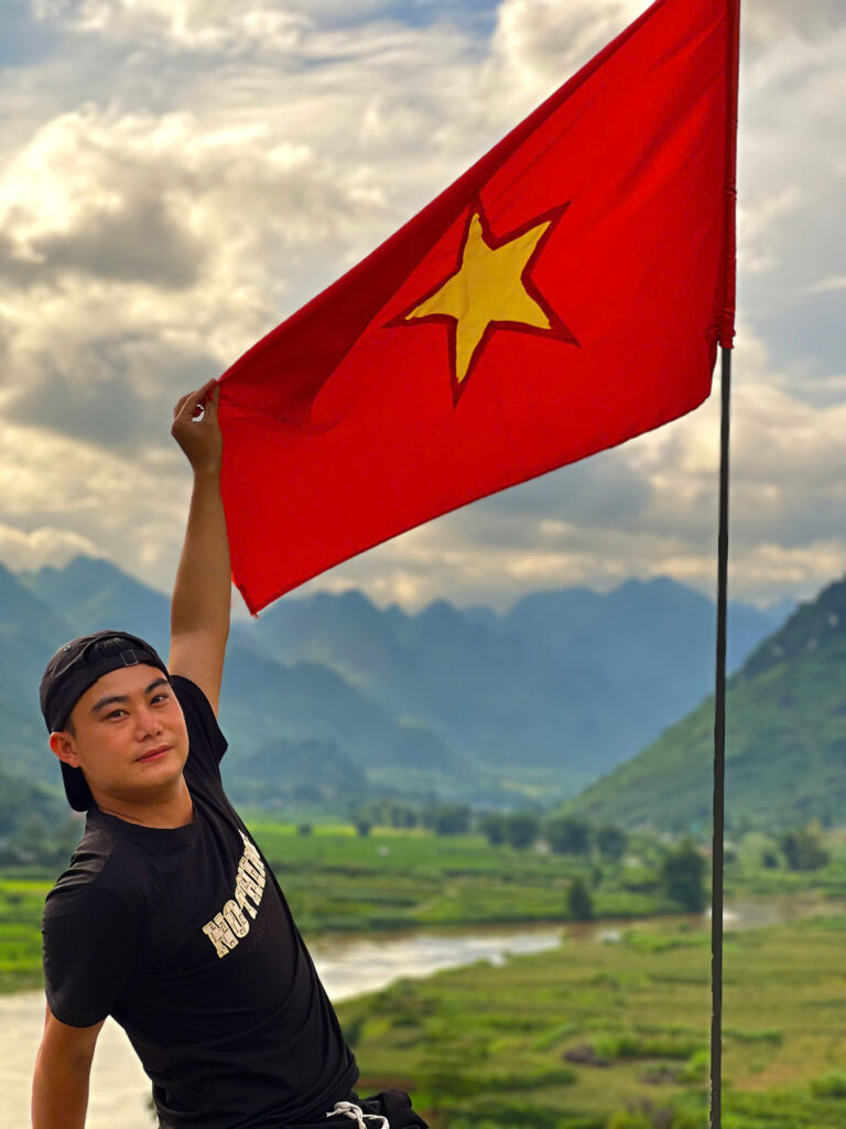 guy holding Vietnam flag