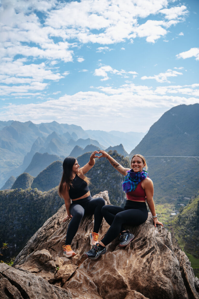 Two girls on top of the mountain on the Ha Giang Loop