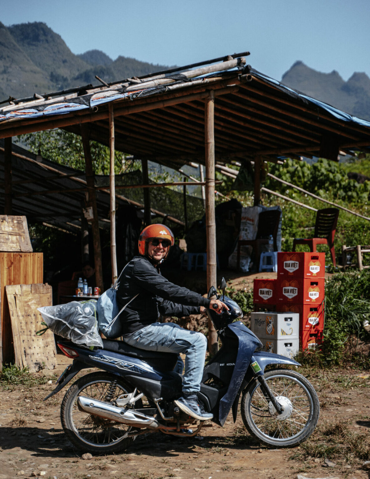 Happy guy driving on a scooter in vietnam
