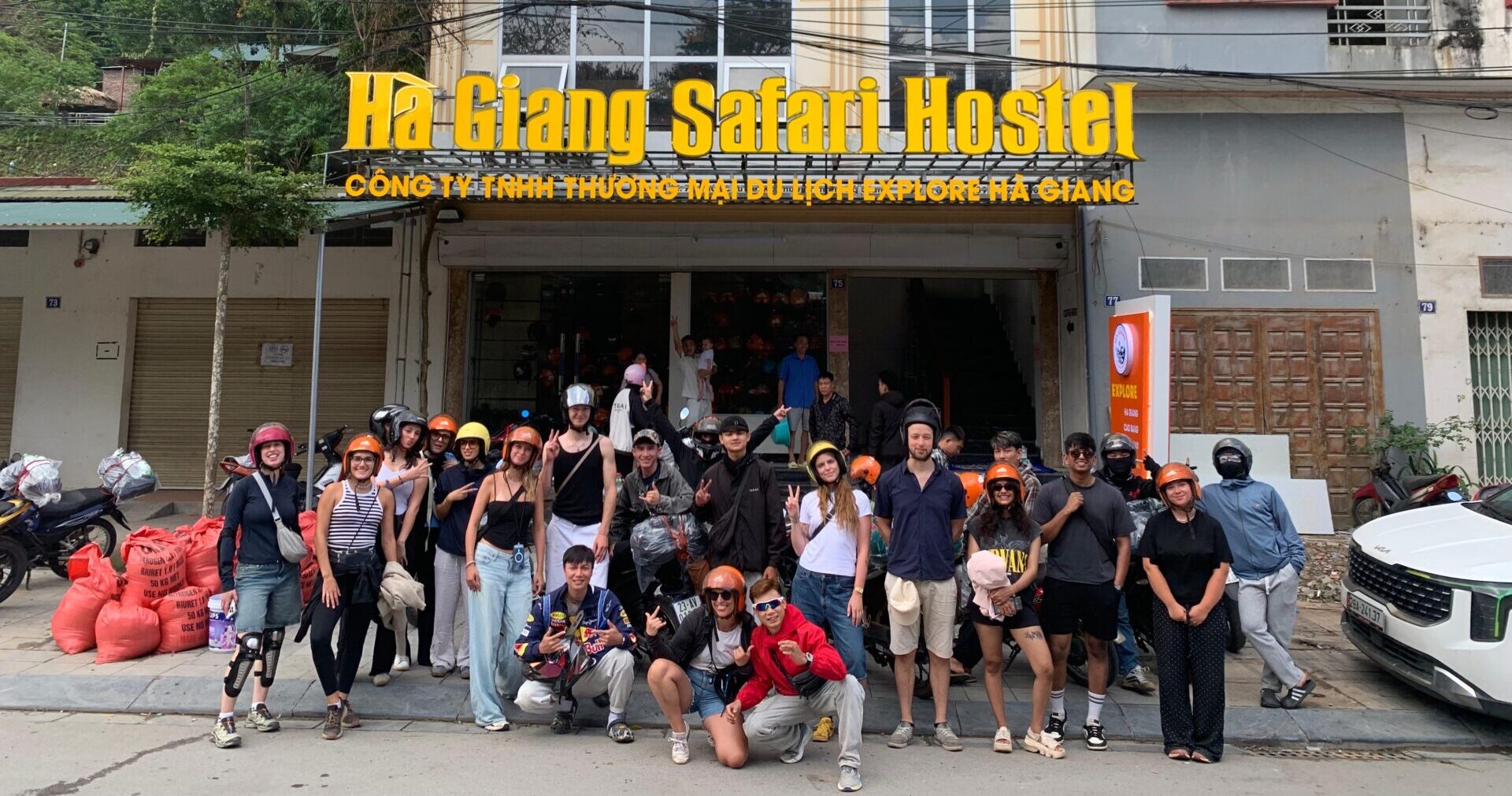 Group of backpackers outside of Ha Giang Safari Hostel ready to go on the Ha Giang Loop