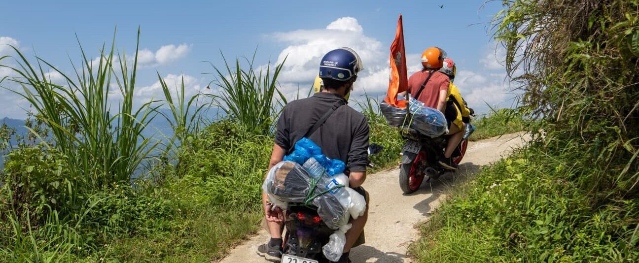 Motorbike driving on a narrow road on the Ha Giang Loop