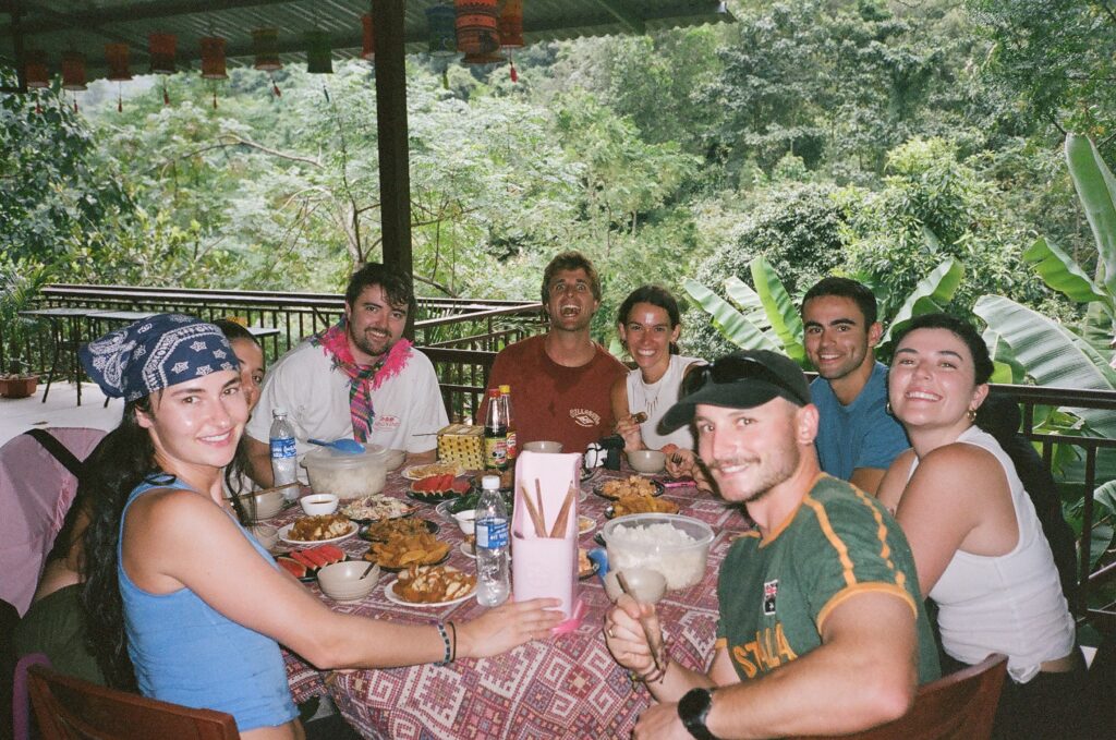Guests sharing a family-style lunch on the Ha Giang Loop